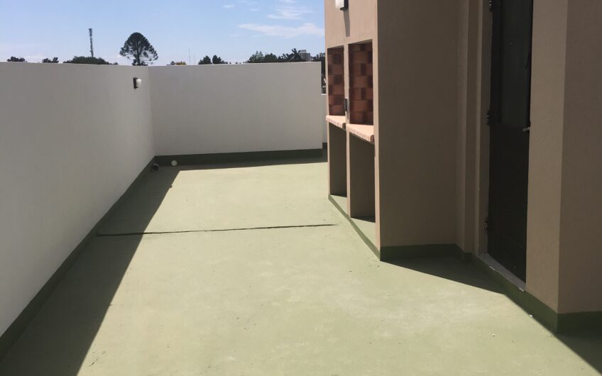 Departamento con Cochera y Terraza con Parrilla