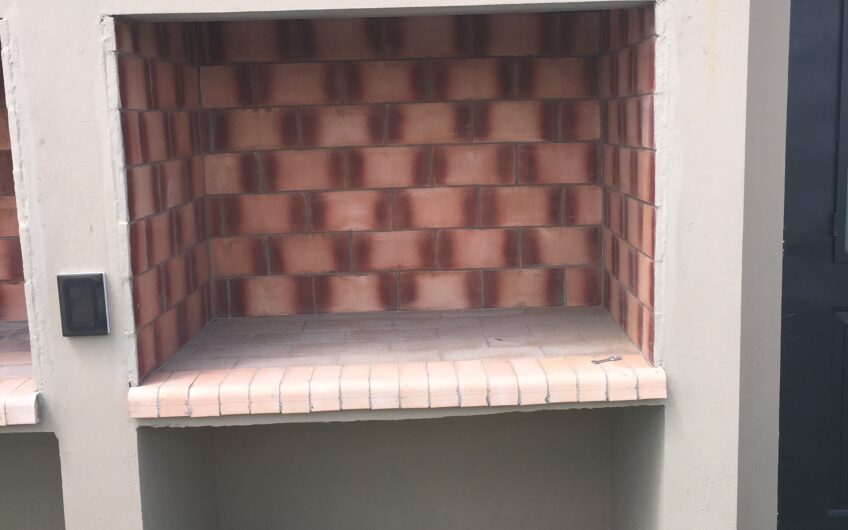 Departamento con Cochera y Terraza con Parrilla